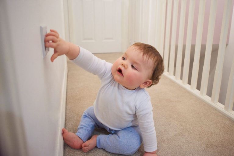 Baby getting too close to a live outlet